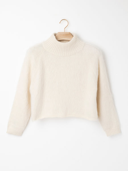 High Neck Cropped Suri Alpaca Jumper crafted from lightweight Suri Air yarn with a folded high neckline, relaxed cropped silhouette and streamlined sleeves.