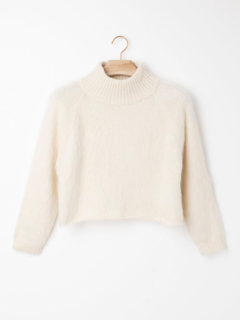 High Neck Cropped Suri Alpaca Jumper crafted from lightweight Suri Air yarn with a folded high neckline, relaxed cropped silhouette and streamlined sleeves.